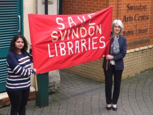 Manetta Rodrigues and Jane Milner-Barry with Save Swindon Libraries banner at Swindon Arts Centre & Public Library